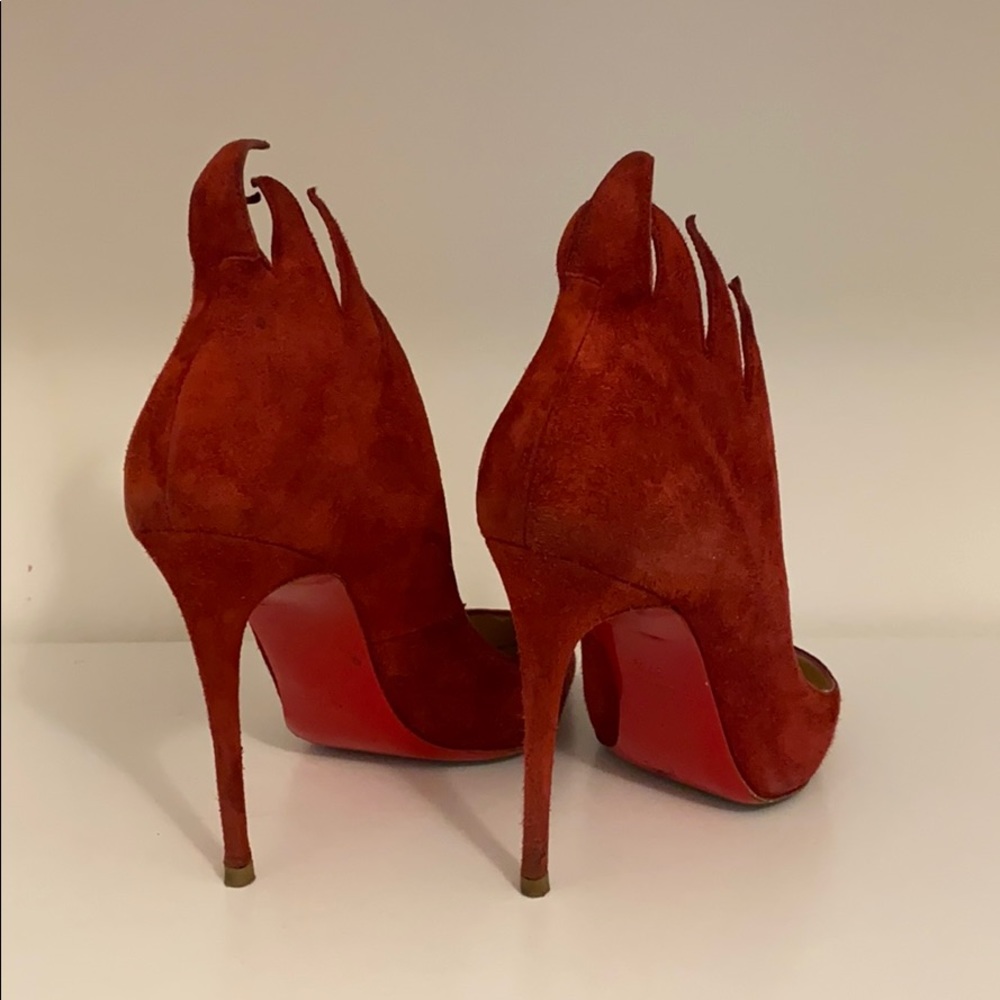 Red louboutin suede shoes